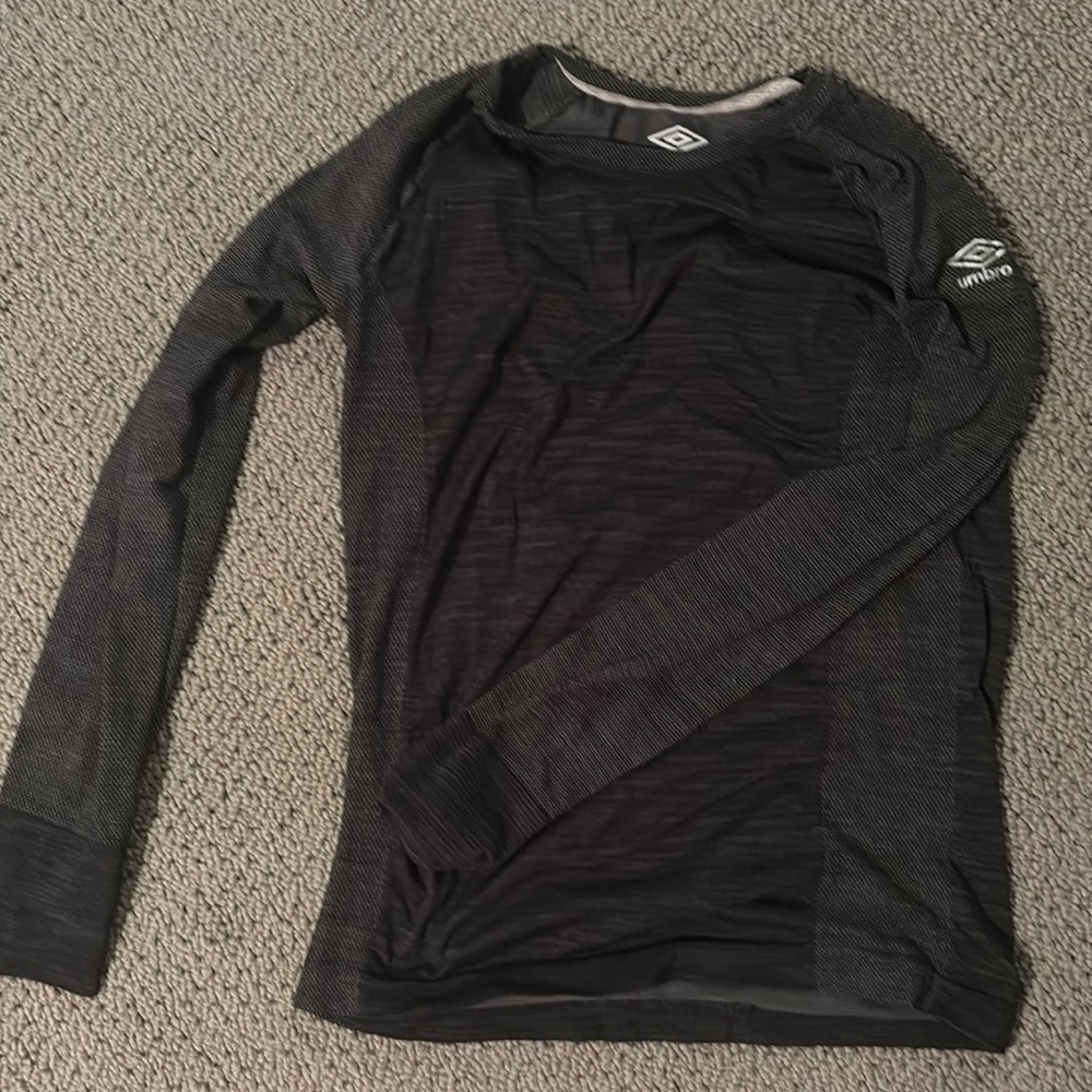 dark grey umbro under shirt, barley worn